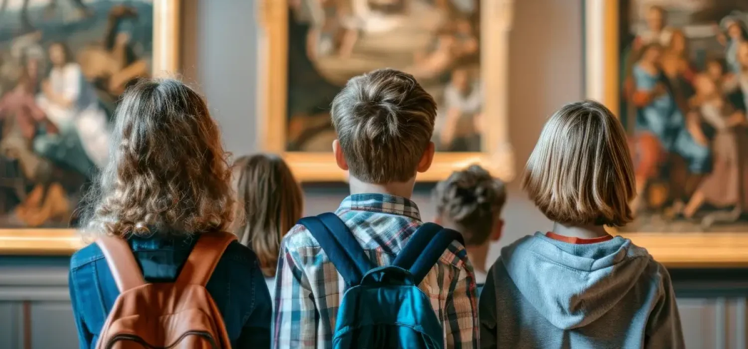 Group of school children looking at the gallery of art. Kids admiring of classical painting during excursion in art museum. Young students are visiting of exhibition.